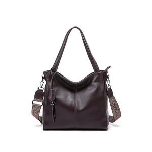 Plum purple genuine cowhide shoulder handbag with rolled handles and leather charm