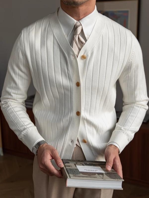 White ribbed knit V-neck cardigan on a model, angled studio view with striped tie