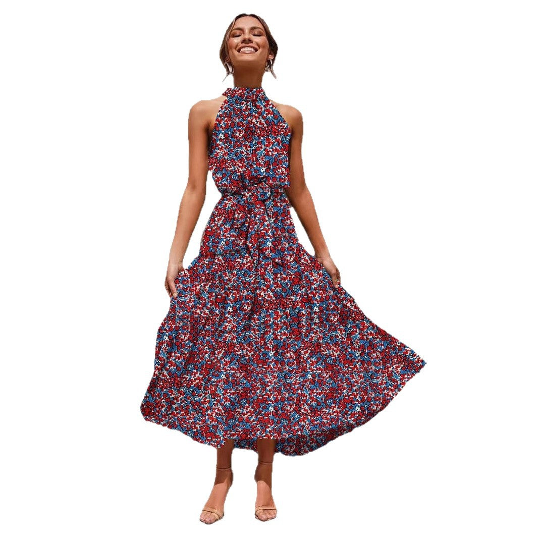 Red and purple floral halter neck sleeveless tiered swing maxi dress shown full length on a white background