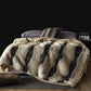 Beige with Black Stripes option: beige vegan fur blanket with wide black stripes on a bed with a tray