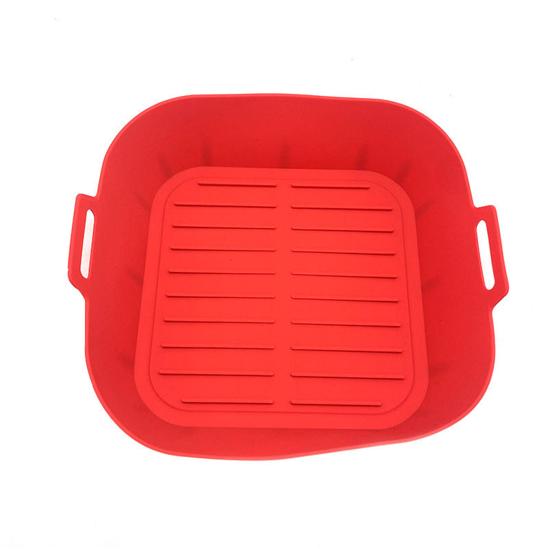 Reusable non stick silicone air fryer liner shown beside the air fryer drawer