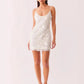 Blue sequin bodycon dress side profile showing the close body-skimming fit and above-knee hem