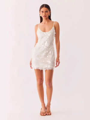 Blue sequin bodycon dress side profile showing the close body-skimming fit and above-knee hem