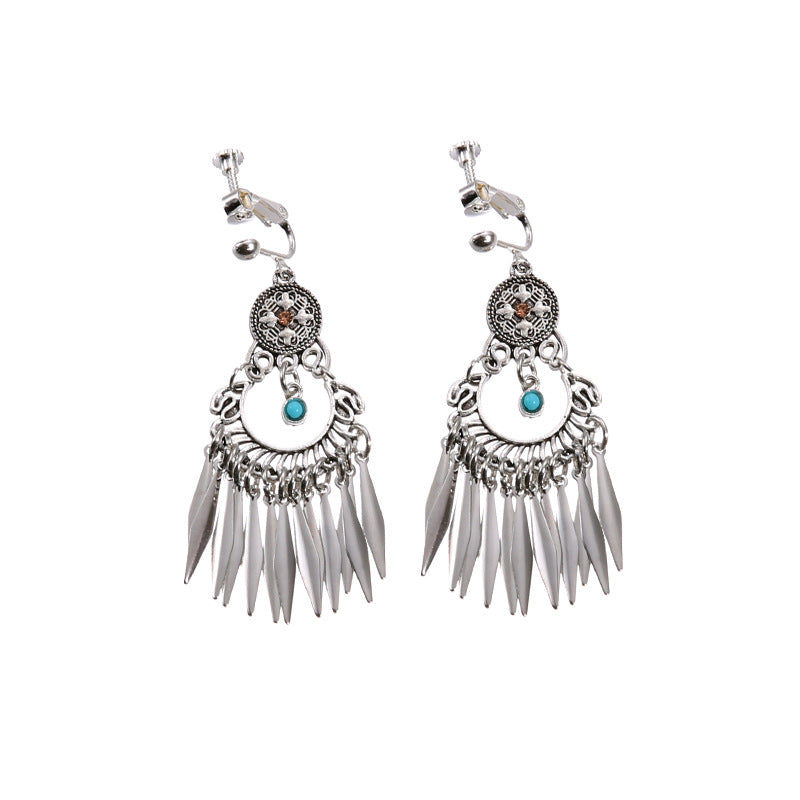 Bohemian tassel and bead clip-on drop earrings, aged tone zinc alloy frame, handmade pair on plain white background