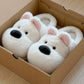 White option, size 40-41: white puppy face plush slippers with pink ears resting in a cardboard box