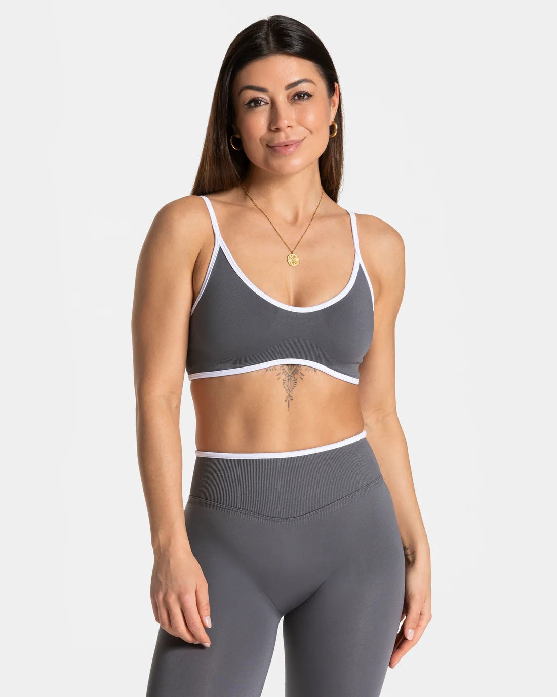 Padded scoop bralette with elastic underband and thin straps, studio shot