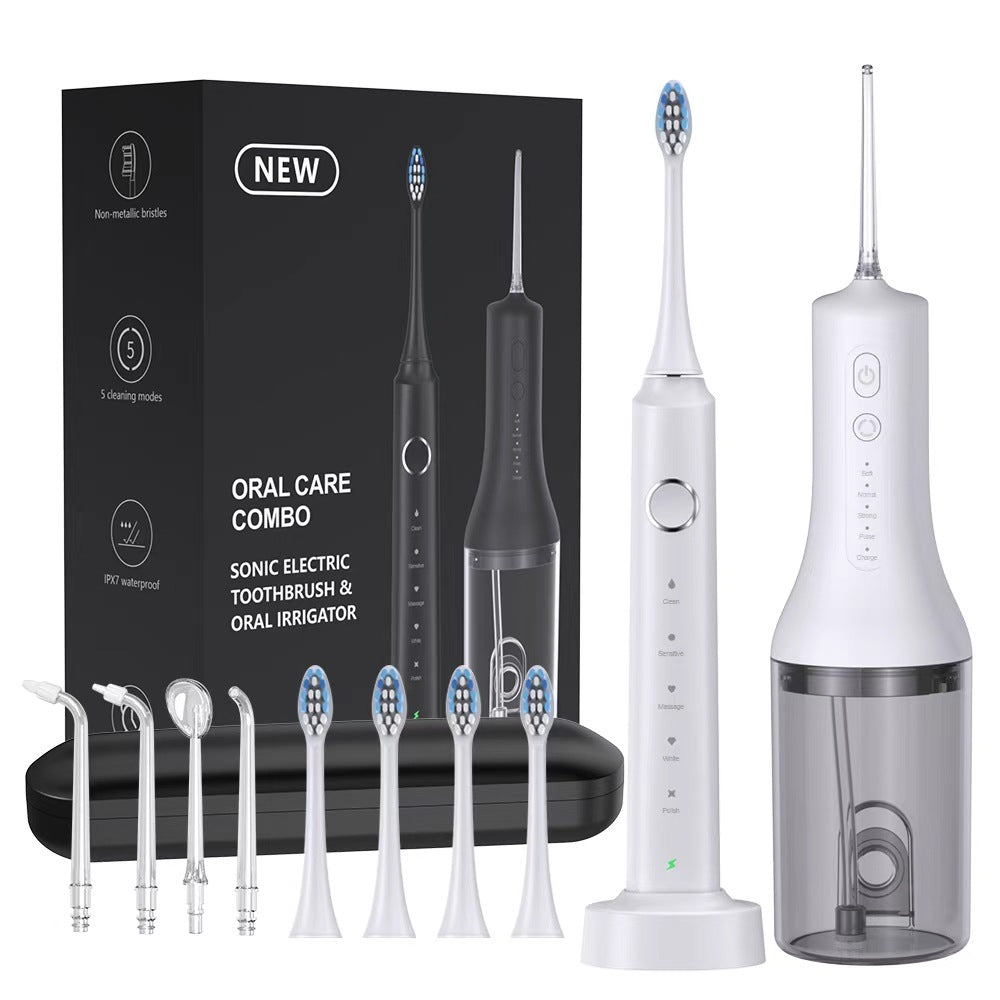 White sonic electric toothbrush with charging base and white water flosser with nozzles, brush heads and set box