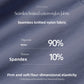Fabric close up of dark gray blue knit labelled 90% nylon, 10% spandex, seamless and four dimensional elasticity