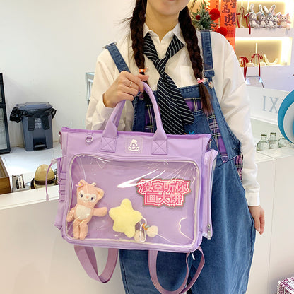 Clear front window nylon shoulder bag with two top handles and a crossbody strap