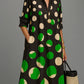 Black and Green Polka Dot polyester shirt collar long sleeve A-line midi dress on a standing model
