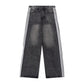 Baggy side-stripe denim jeans styled with an oversized tee and trainers