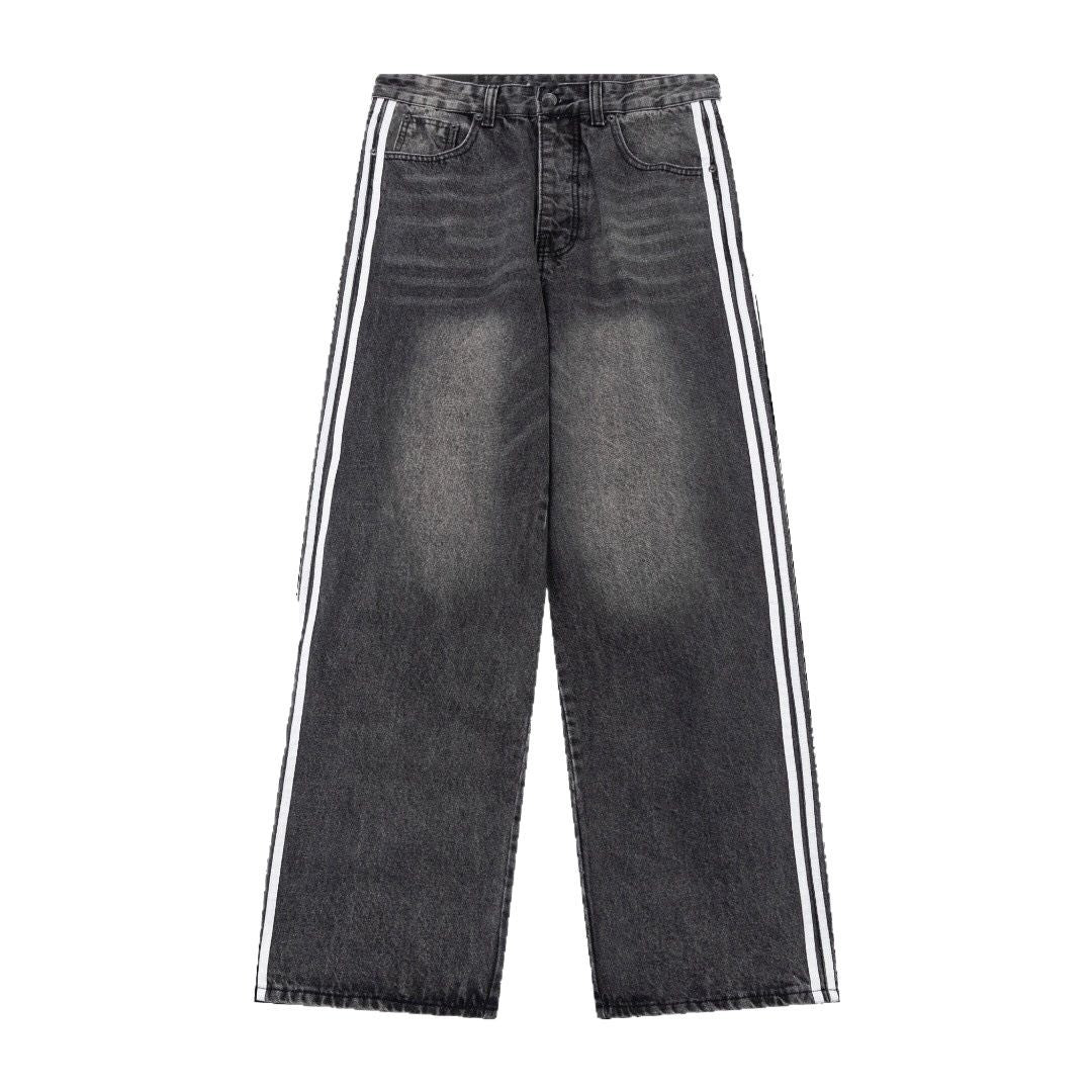 Baggy side-stripe denim jeans styled with an oversized tee and trainers