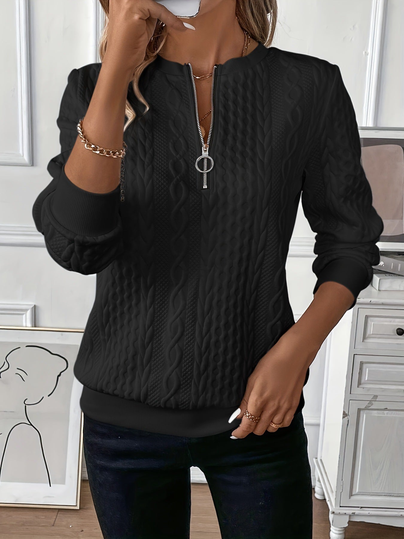 Womens cable knit quarter zip pullover with a mock neck and ribbed cuffs, front view