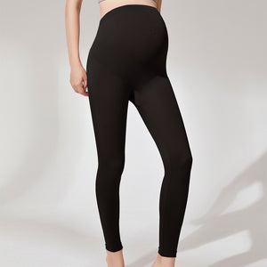 Black maternity leggings with a tall stretch belly panel shown on a model front view
