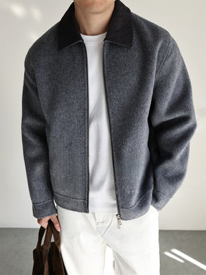 Side profile of the short wool blend zip jacket showing the sleeve and shoulder line
