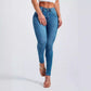 Denim blue high rise skinny jeans front view on a model, size M option