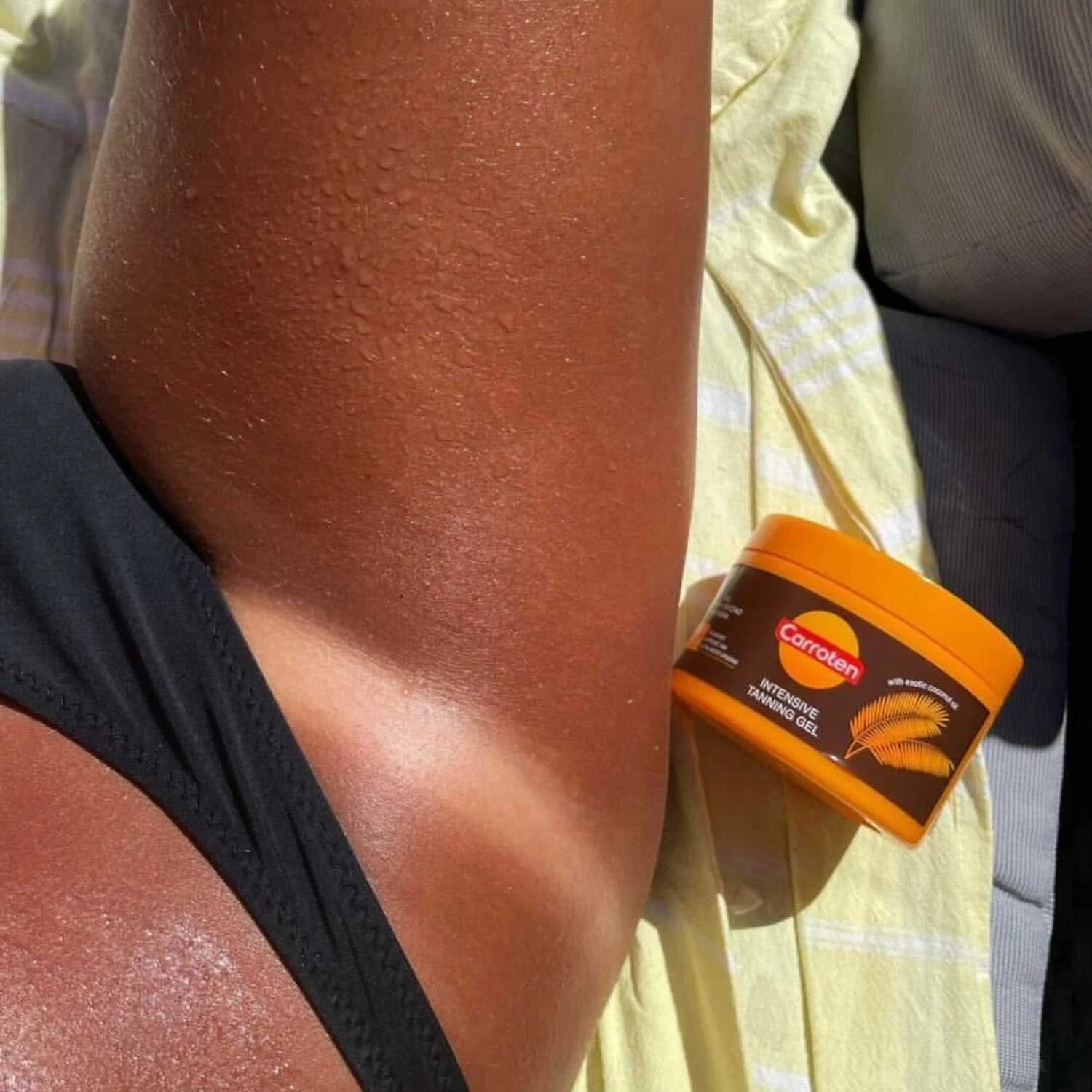 Detail of the tan finish on smooth, hydrated sun-warmed skin