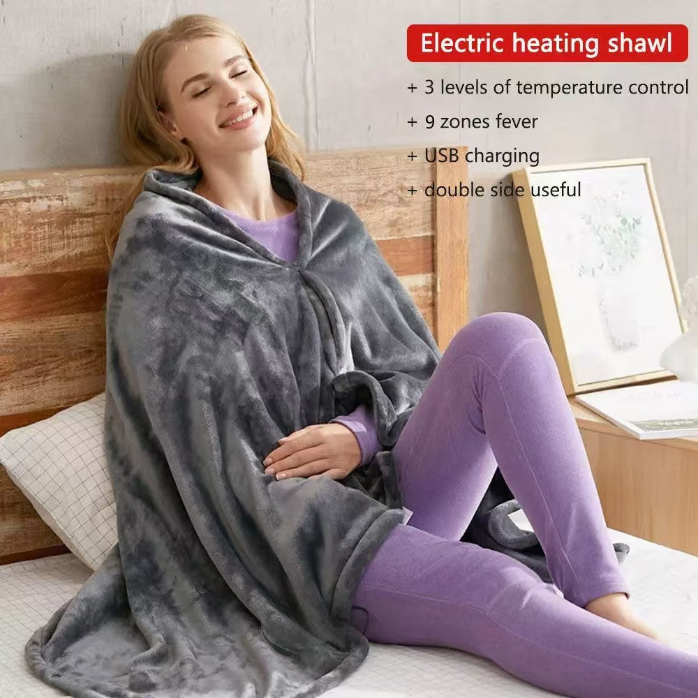Woman sitting on a bed wrapped in the dark gray heating shawl, text electric heating shawl, 3 levels, USB