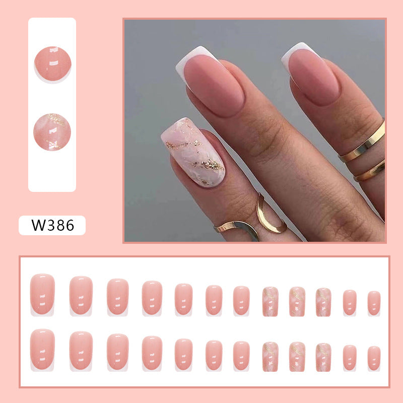 Full cover press-on almond nails in a stone pattern, glossy finish shown on a hand