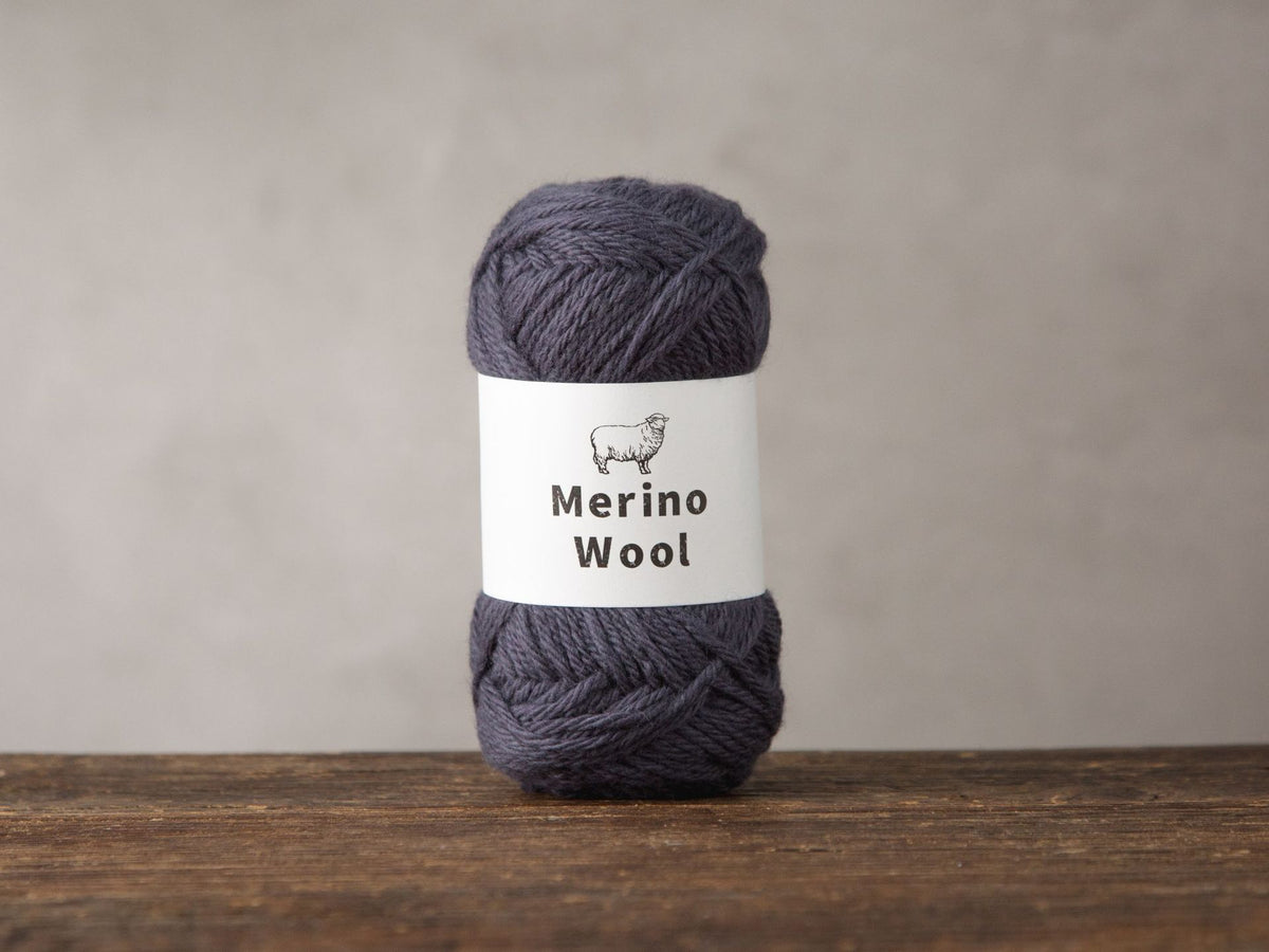 Group of soft merino wool knitting yarn balls in five muted colours