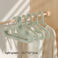 Light green Adult Hanger on a wooden rail beside a white garment, 23.7 x 41 x 2 cm