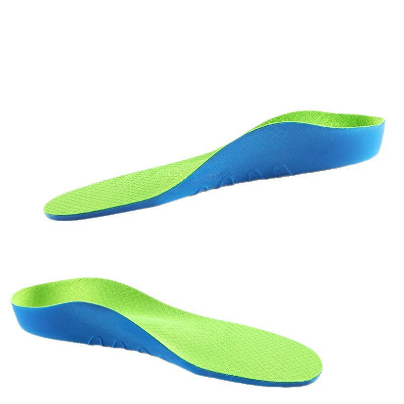 Pair of green and blue childrens cushioned PU arch support insoles on a plain background