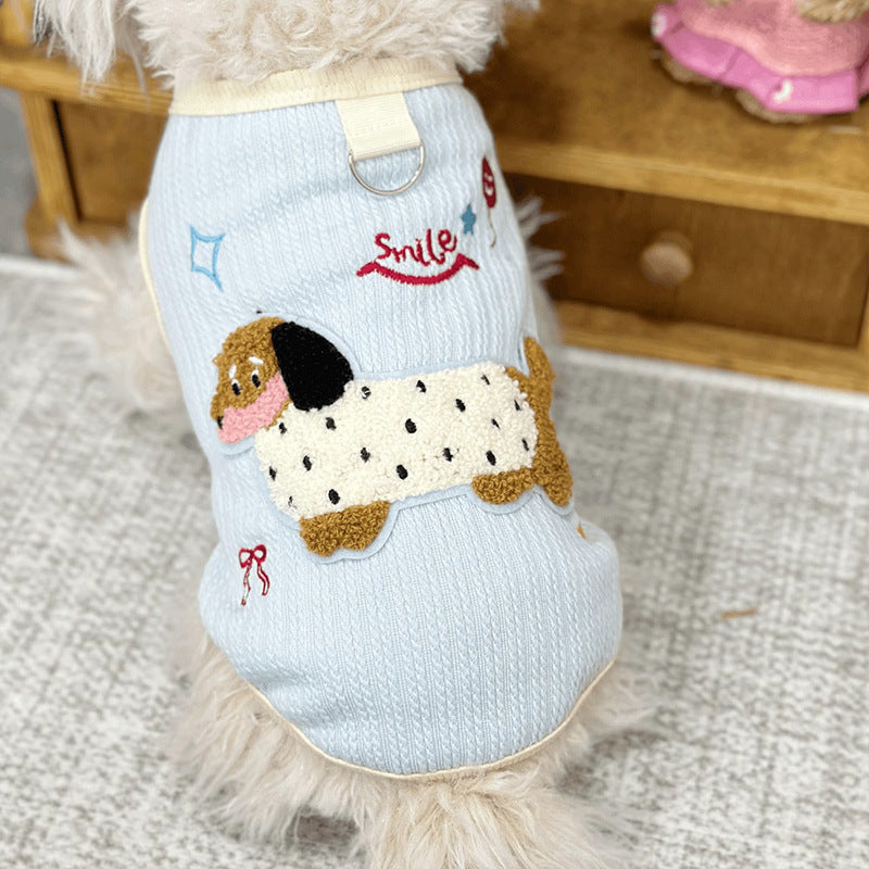 Sleeveless small dog vest with a back leash D-ring and a dachshund applique three quarter view on a small dog