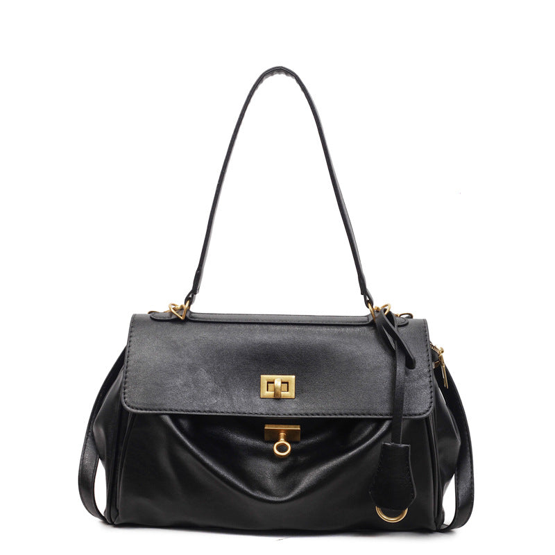 Tan PU tote bag standing upright on flat base