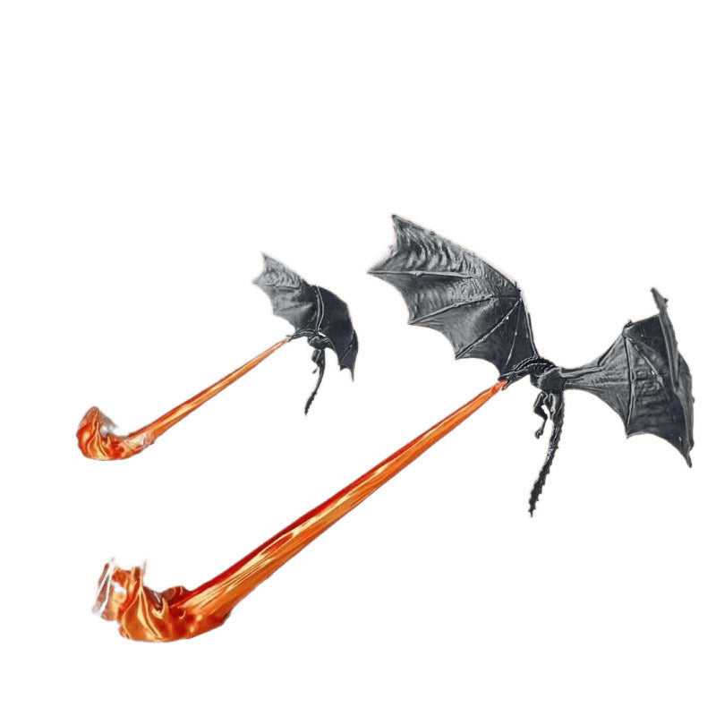 Black dragon ornament with a red sculpted flame base standing on a dark surface