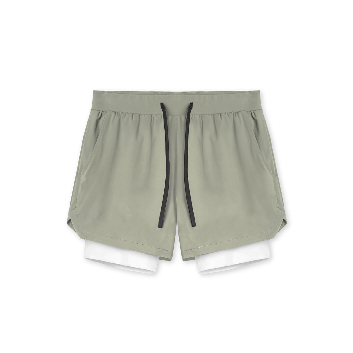 Two in one training shorts in sage green shown flat with the inner liner, side view