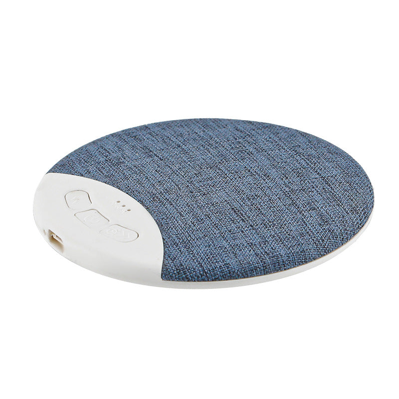 Night Blue color option of the round fabric Bluetooth pillow speaker with white buttons section, on white background