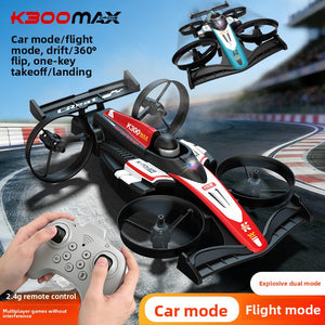 Red K300 Max drone drifting on a race track in ground mode while a hand works the 2.4G handset