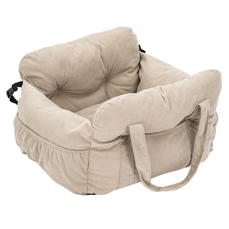 Padded car seat pet bed with raised bolster walls, carry handles and an inner clip showing the seat anchoring strap