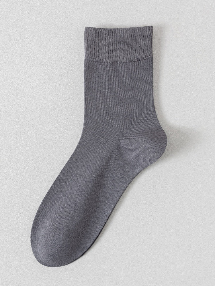 Dark grey bamboo viscose blend mid calf sock laid flat on a pale background