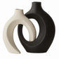 Matte ceramic nesting vase set in a neutral tone against a plain wall