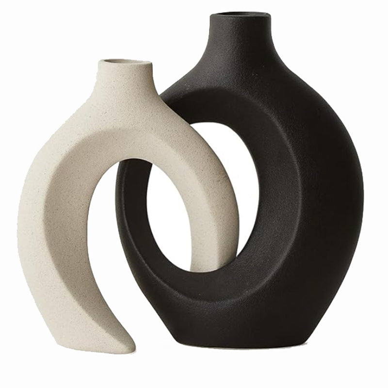Matte ceramic nesting vase set in a neutral tone against a plain wall