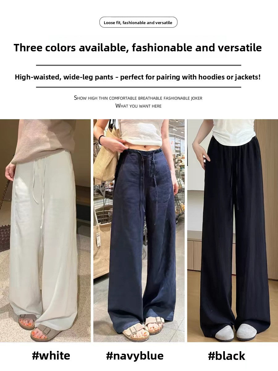 Womens high waist wide leg linen blend drawstring trousers, close up of the lightweight woven linen blend fabric