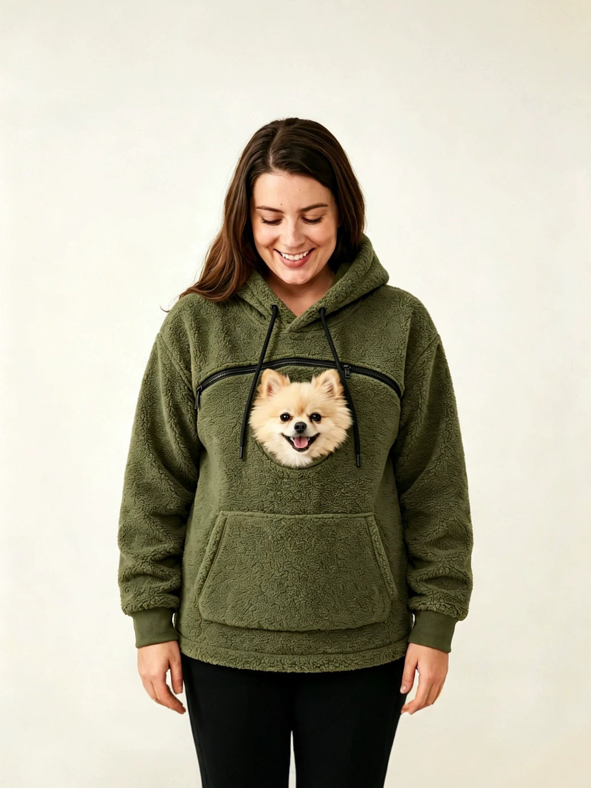 Army green teddy fleece hoodie with a chest opening where a small dog's head looks out above a front pocket
