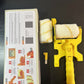 Yellow handle set beside its color box with an instruction panel, a second roller and a small brush, Color Box option