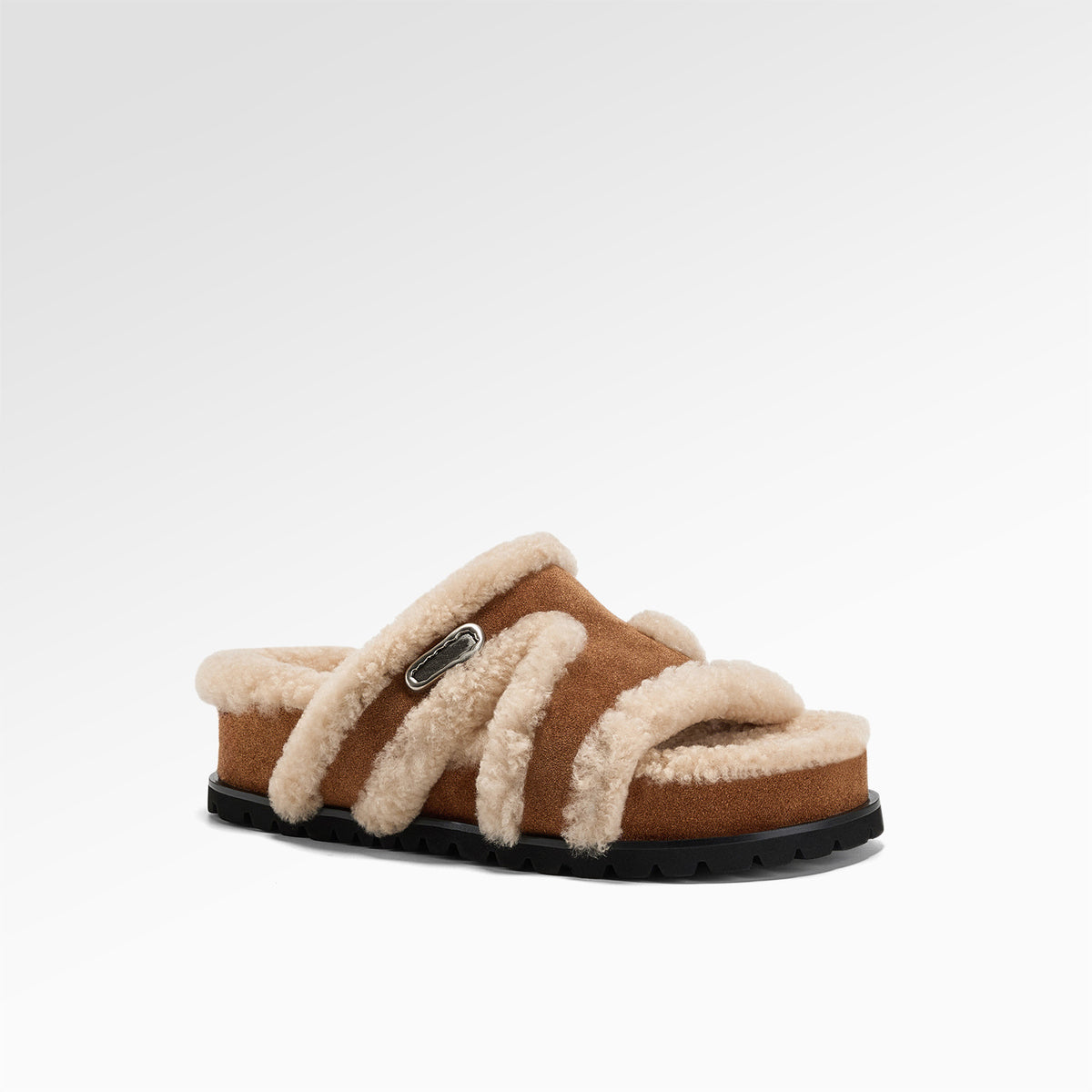 Close view of the plush fleece footbed inside the open toe suede slipper