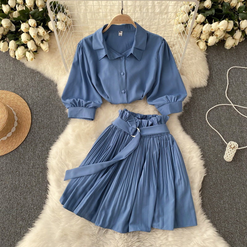 The short-sleeve shirt and skirt set worn during a casual daytime moment