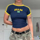Short sleeve crop country tee shown flat with ringer sleeve cuffs