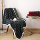 Green and blue plaid coral fleece blanket in 100 x 140 cm draped over a green chair with a cup