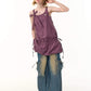 Adjustable shoulder ties of the camisole dress tied in a bow