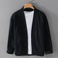 Black ramie blend open front jacket with a stand collar and roll back cuffs