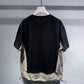 Back view of the black panel short sleeve tee with washed grey hem and drawcord toggles
