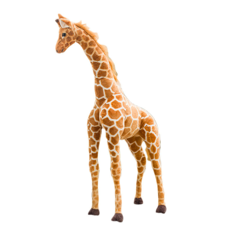 Single tan giraffe plush toy standing in side profile on a plain white studio background