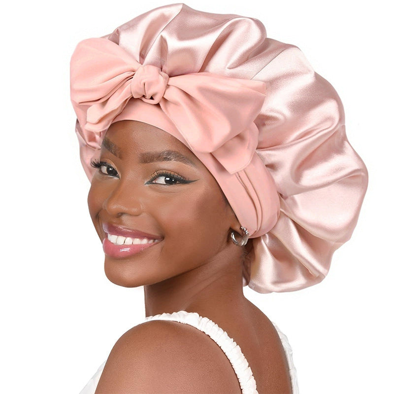 Roomy satin sleep cap with a bow tie band, one size for long or thick hair