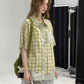 Green plaid short sleeve doll collar shirt worn for casual daytime wear
