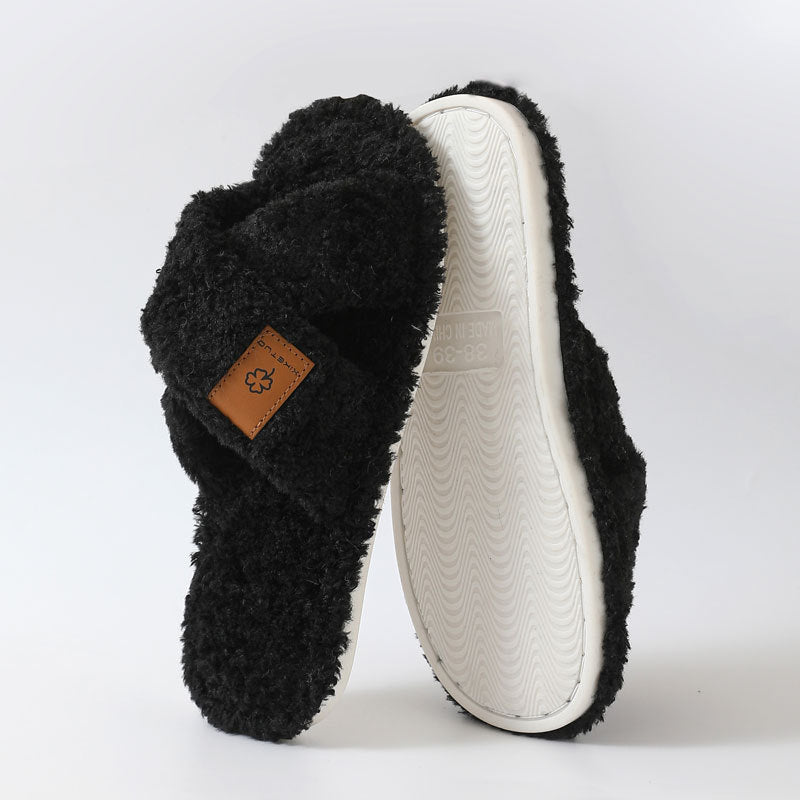 Black crossed plush open toe slipper standing beside its textured TPR sole, size 38-39 option